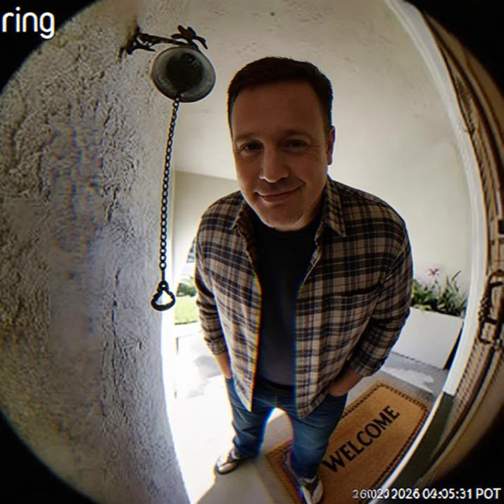 Doorbell Chud — Ring doorbell footage of a man in glasses wearing a Billions Must Die t-shirt at a doorstep