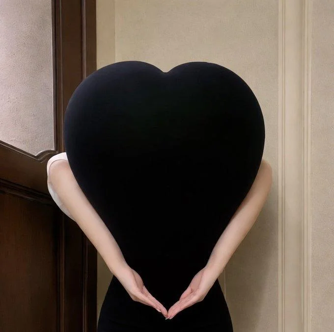 Heart Butt Challenge — Woman in pink gradient dress bent forward forming a heart shape with her silhouette